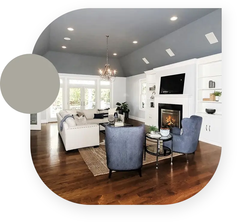 A living room with a fireplace and a large window.